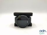 a close up of a camera lens sitting on top of a case