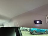 cars are parked in a parking lot with a blue car in the background