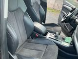 the interior of a car with the door open and the seats down