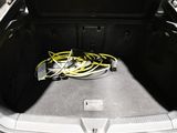 a trunk of a car with a bunch of wires in it