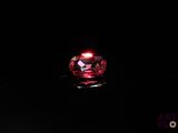 an image of a red diamond in the dark