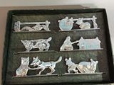a box that has a bunch of silver figurines in it