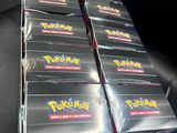 a close up of a box of pokemon cards on a table