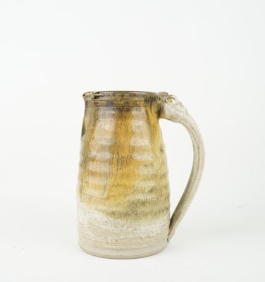 a close up of a coffee mug on a white surface