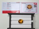 an image of a picture of a yellow diamond in a display case