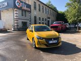 a yellow car parked in front of a building