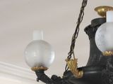a chandelier hanging from the ceiling in a room