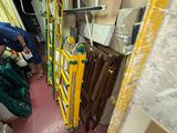 a man that is standing in a room with a ladder