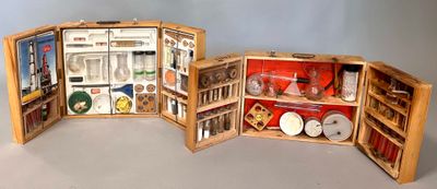 three open wooden shelves with various items in them