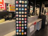a display of donuts on a black rack in a store