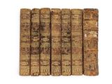 a group of old books sitting on top of each other