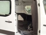 a white van with the door open and the seat down