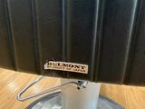 an image of a close up of a chair with a label on it