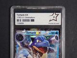 a close up of a pokemon trading card on a table