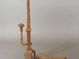 a wooden pole with a lamp on top of it