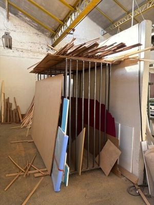 a picture of a room that has a lot of wood on the floor
