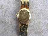 an image of a close up of a wrist watch on a table