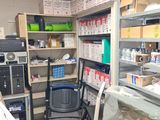 a room that has a lot of shelves and a chair in it