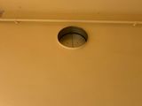 a clock on the wall in the corner of the room