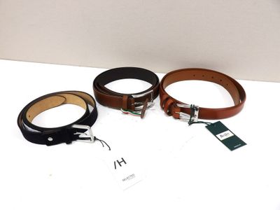 three belts with tags on them sitting on a white surface