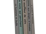 four books that are stacked on top of each other