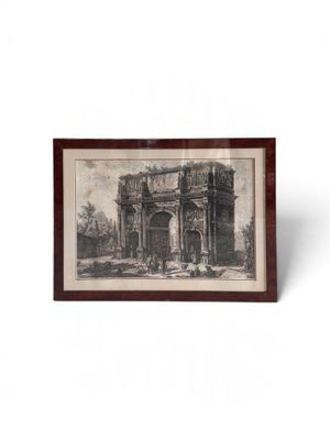 un dessin en noir et blanc représentant un bâtiment, dans un cadre en bois
