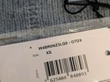 a label on the back of a sweater with a barcode on it