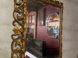a mirror on the wall above a sink in a bathroom