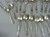 a lot of silver spoons and spoon spoons on a table