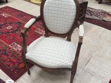 a chair that is sitting in the middle of a room