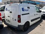 a white van that is parked in a parking lot