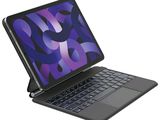 a black laptop with a blue keyboard on a white background