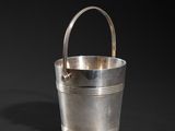a silver bucket with handle on a black background