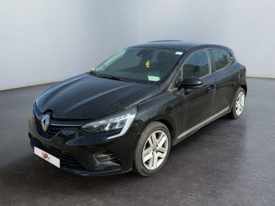 the black car is parked in a room with a white wall