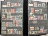 many different stamps on the cover of a book