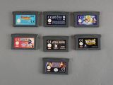several nintendo game cartridges are lined up in a row on a table