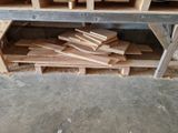 a pile of wood on a shelf in a room