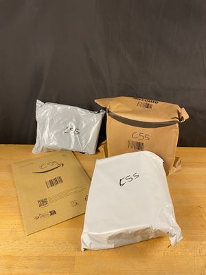 three bags of food sitting on a table next to a bag of food