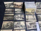 a lot of old postcards that are on a table