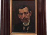 a painting of a man in a suit and tie in a wooden frame