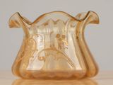 a glass vase that is sitting on a table
