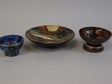 three small bowls and a small bowl are sitting on a table