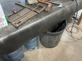 a table with tools on it in a garage
