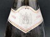 a close up of a bottle of wine on a table