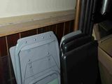 several chairs and a television in a room
