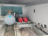 a picture of a room with a tank and a water heater