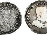 Gros plan sur une pièce de monnaie portant le visage d'un homme