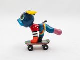 a figurine of a person riding a skateboard