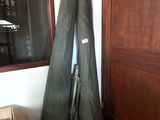 two surfboards and a box in a room