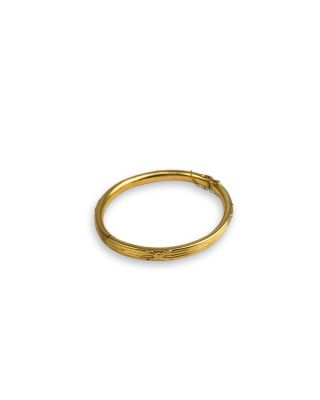 a close up of a gold ring on a white background